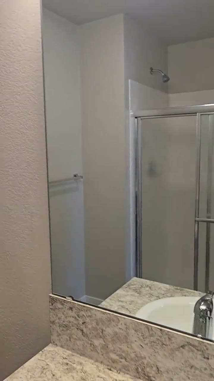 A clean bathroom and vanity from a Dianis Cleaning LLC work video